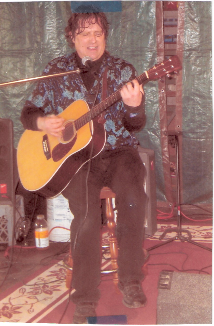 Doug Rice playing acoustic guitar